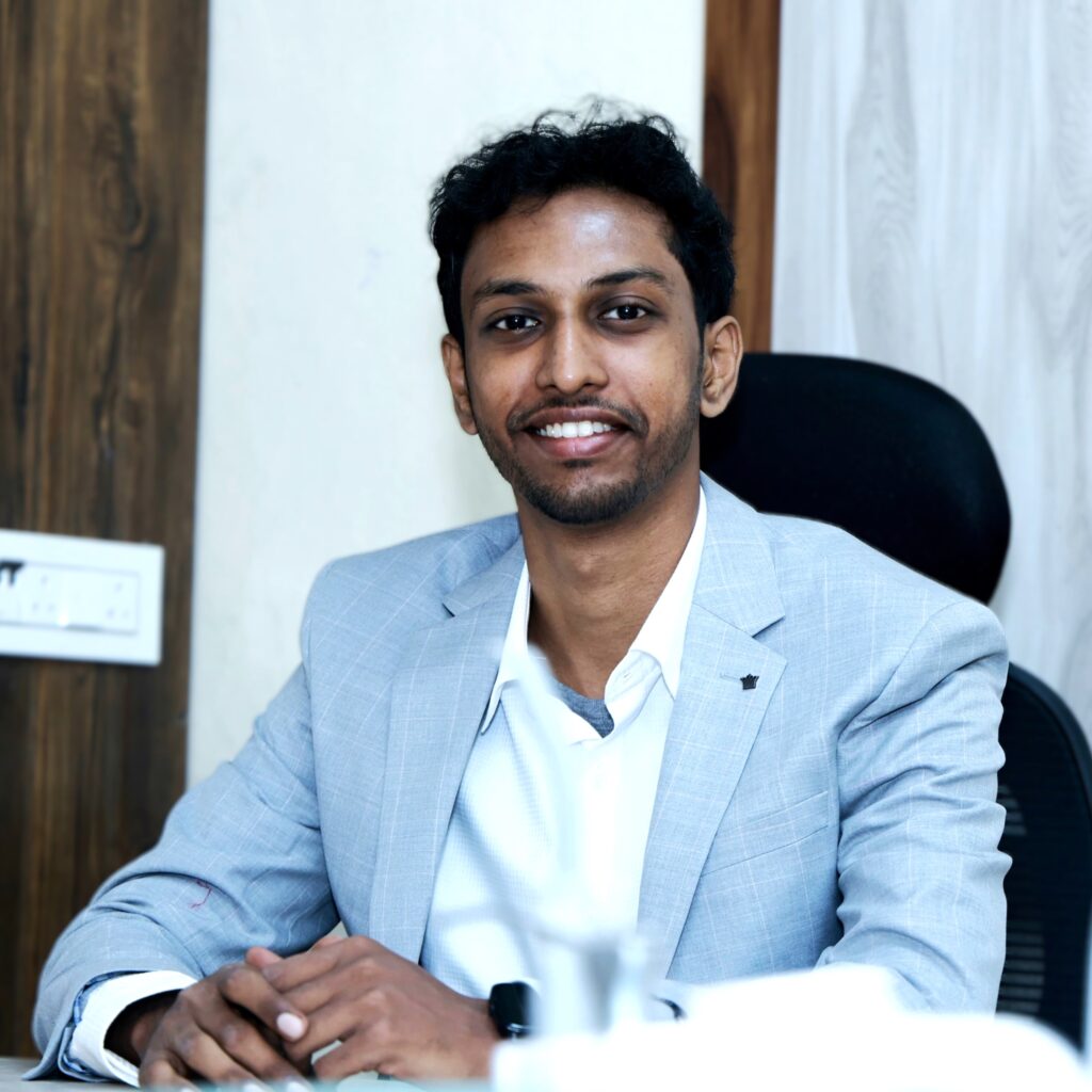 Dr. Shekar Subramanian, MDS, Specialist Orthodontist and founder of Elegance Dental & Multi-Speciality Clinic, in professional business attire.